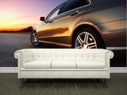 Rear-side view of a luxury car on sunset Wall Mural-Transportation-Eazywallz